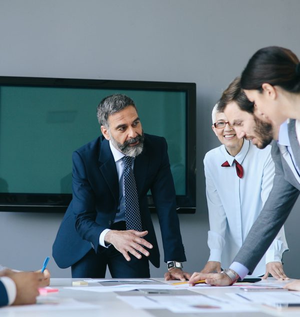 Business People Having Board Meeting In Modern Office Business People Having Board Meeting In Modern Office