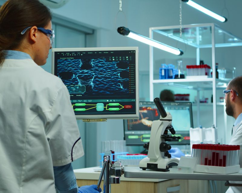 Team of medical research scientists using modern technology Team of medical research scientists using modern technology